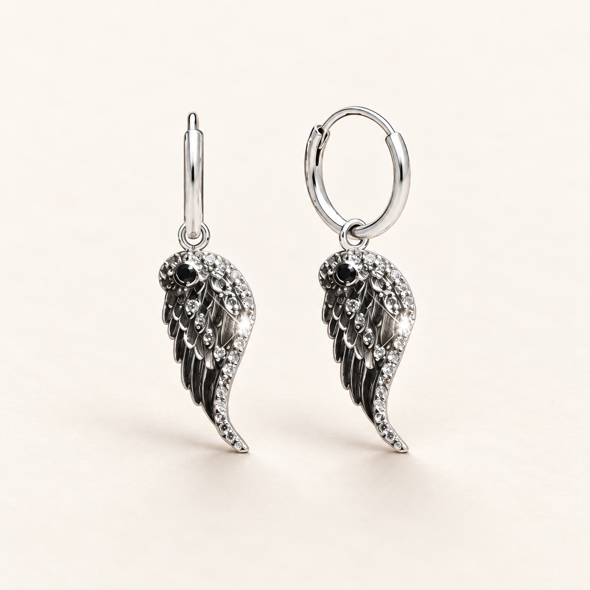 Sterling silver and cubic zirconia angel wing drop earrings