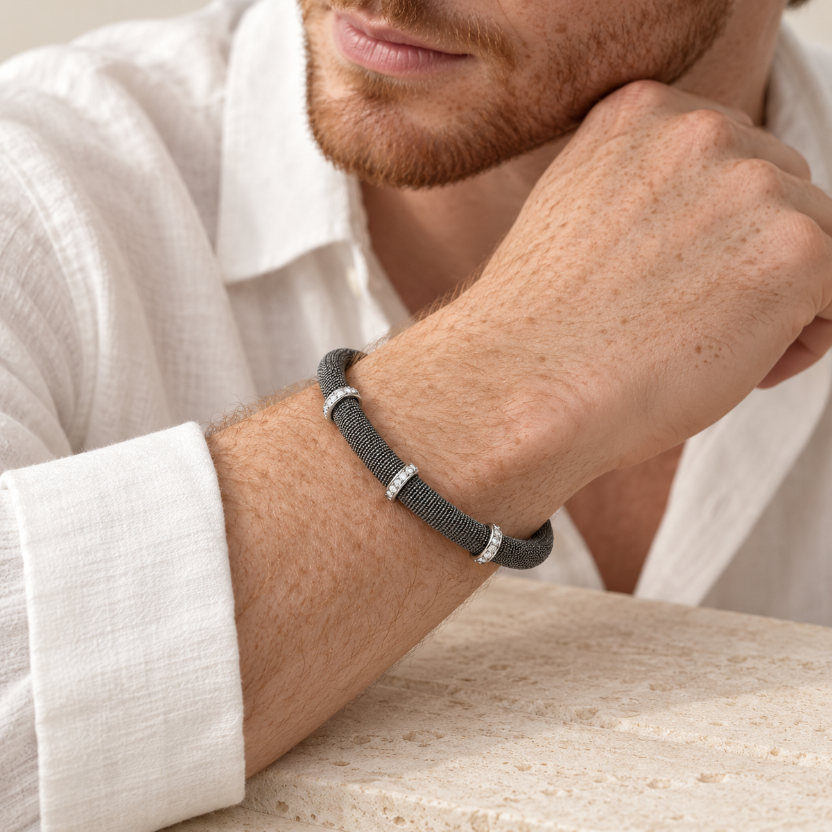 Ruthenium magnetic bracelet with three rows of cubic zirconias